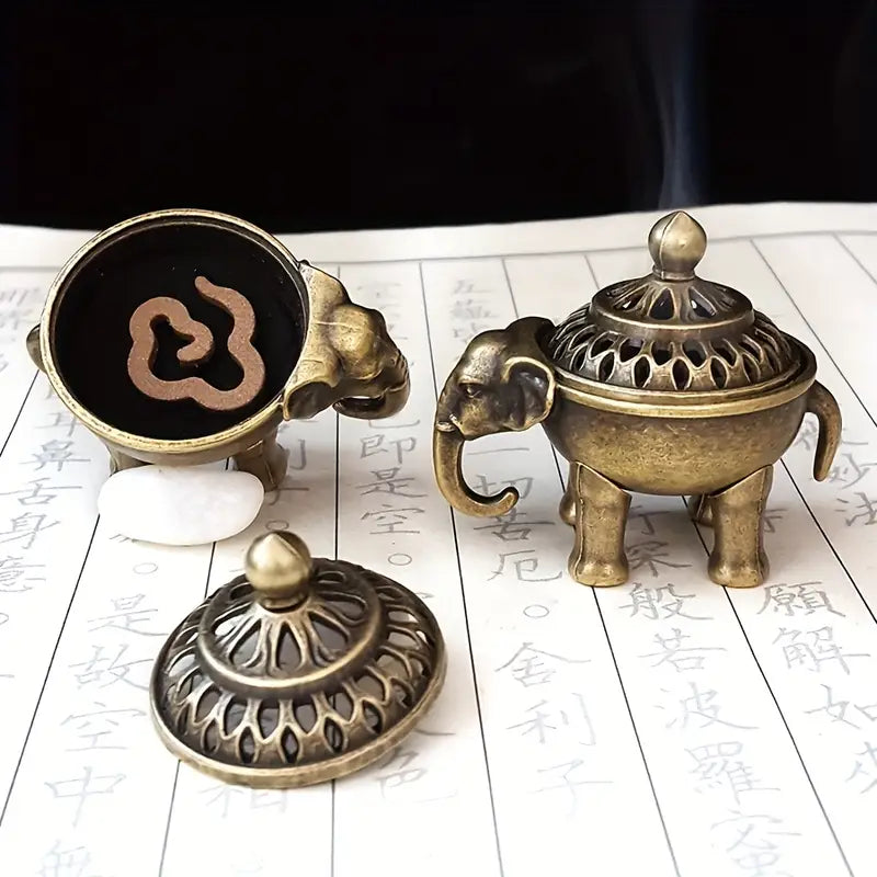 Gold finish incense burner on a wooden table