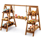 A wooden A-frame dessert display stand with rope hanging elements, shown on a white background and filled with cupcakes, muffins, pastries, and small fruit desserts.