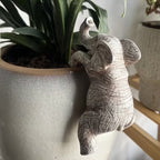Dkor Ltd off-white elephant pot hugger figurine with detailed texture, designed to hang on plant pots.