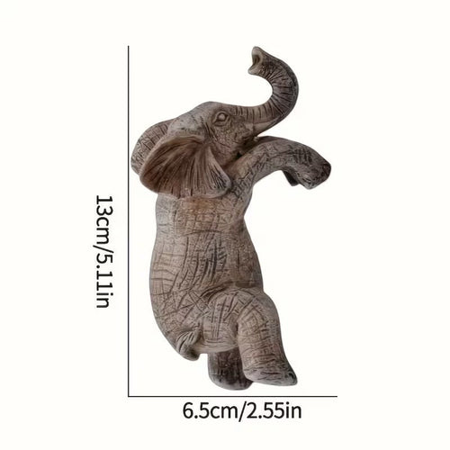 Dkor Ltd grey resin elephant pot hugger figurine with trunk raised, designed to perch on plant pots.