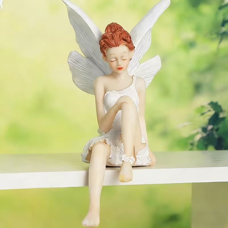 Dkor Ltd whimsical fairy figurine with white wings and dress, sitting on a wooden swing in a magical forest setting with glowing butterflies.